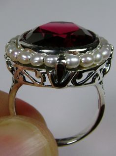 Ruby Ring, Seed Pearls surround and accent the simulated oval stone with sterling silver Victorian filigree Ring Pearl, Silver Leaves, Pearl Design, Seed Pearl, Victorian Jewelry, Ruby Gemstone, Red Ruby, Delicate Rings, Silver Filigree