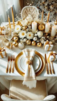 the table is set with gold and white decorations