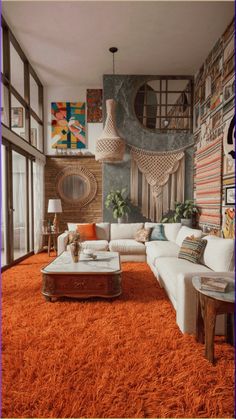 a living room filled with lots of furniture and orange rugs on top of an area rug