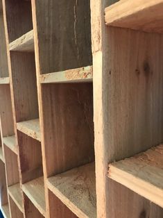 the shelves are made out of wood and ready to be used as bookshelves