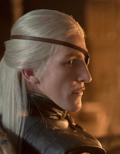 a man with white hair wearing a leather jacket and blindfolded headband in a scene from the television series game of thrones