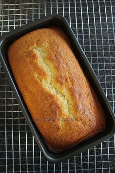 a loaf of bread sitting on top of a cooling rack