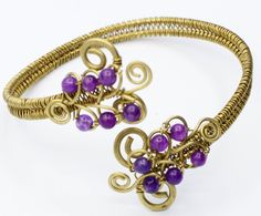 Introducing our enchanting Brass Shoulder Bracelet with Purple Agate Stones - a true embodiment of artisan craftsmanship. This meticulously handcrafted piece seamlessly blends the warmth of brass with the allure of purple agate stones, creating a unique accessory that captivates the senses. The shoulder bracelet features a delicate and adjustable design, ensuring a comfortable fit that elegantly drapes over your shoulder. The intricate brass detailing adds a touch of sophistication, while the vi Spiritual Purple Jewelry With Unique Variations, Purple Artisan Hand-wrapped Jewelry, Artisan Purple Hand Wrapped Jewelry, Artisan Hand Wrapped Purple Jewelry, Handmade Purple Agate Jewelry, Handmade Spiritual Purple Bracelet, Hand Wrapped Purple Bracelets As Gift, Bohemian Gold Amethyst Beaded Bracelets, Gold Bohemian Amethyst Beaded Bracelets