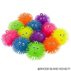 a pile of colorful toy balls with eyes on them