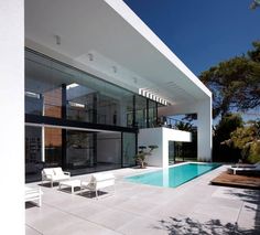 a modern house with a swimming pool in the backyard