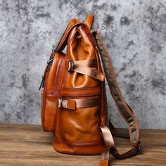 Discover the ultimate men's travel companion in our genuine leather backpack. A stylish rucksack that's a perfect gift for him. Free shipping on all our leather bags. It takes approx seven business days to complete each leather bag. Features: 1. High-quality leather material for durability and style. 2. Spacious main compartment for all your essentials. 3. Additional front and side pockets for easy access to smaller items. 4. Stylish vintage design for a unique and timeless look. 5. Interior: Ce Leather Backpack For Trip, Luxury Brown Leather Backpack For Trips, Luxury Brown Leather Backpack For Travel, Luxury Brown Backpack For Outdoor, Rucksack Style, Men Backpack, Rucksack Bag, Mens Travel, Travel Work