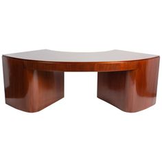 an oval wooden table with curved legs