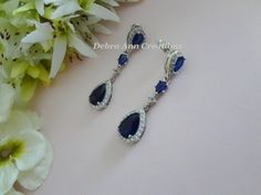 Same Style Earrings-Longer: https://www.etsy.com/listing/1275764836 Similar Design with Clear and Sapphire Cubic Zirconia: https://www.etsy.com/listing/1356886465 Matching Hair Pin: https://www.etsy.com/listing/880678156 Matching Bracelet: https://www.etsy.com/listing/1353304140 https://www.etsy.com/listing/1456206829 Item #BRER4084 These Handmade, Original Design crystal earrings are comprised of Sapphire Cubic Zirconia Teardrop framed with round CZ crystals, Cubic Zirconia Teardrop Round/Diamo Blue Drop Bridal Earrings For Formal Events, Blue Drop Bridal Earrings For Formal Occasions, Blue Drop Bridal Earrings, Elegant Blue Drop Bridal Earrings, Elegant Blue Teardrop Bridal Earrings, Formal Blue Teardrop Chandelier Earrings, Blue Teardrop Chandelier Earrings For Anniversary, Blue Teardrop Chandelier Earrings For Formal Occasions, Blue Teardrop Bridal Earrings For Anniversary