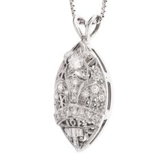 This beautiful pendant is a striking combination of filigree and diamonds, and though it's relatively large (30mm x 13mm), the filigree and the cutouts help create a delicateness. At the top of the pendant is a 3.2mm diamond set into the middle of a white gold star. Ideally suited to hang from a white gold chain (not included), this pendant is a real conversation starter! The design is attributed to the Amaranth Matron, which is the highest rank in the Order of the Eastern Star, an organization Luxury Filigree Diamond Necklace For Formal Occasions, Luxury White Gold Diamond Necklace With Filigree, White Gold Diamond Necklace With Filigree, Diamond Filigree Pendant Jewelry, Art Deco Diamond Necklace With Filigree Details, Filigree Diamond Pendant Jewelry, Elegant Filigree Diamond Pendant Necklace, Luxury Silver Diamond Filigree Necklace, Luxury Silver Filigree Diamond Necklace