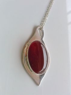 "this beautiful red carnelian is settle on a Silver tear drop hand made with sterling silver, it has a loop that can be used as bail. The stone is 18 x 25 mm and the teardrop is 0.8 mm thick, the chain is 16 inches and 1 mm thick This a special design matches with the carnelian rings that you can see in these links: http://etsy.me/1Tzy0fP http://etsy.me/1TyuVSF *This jewel will be sent to you in a gift box * All the pieces are Hand Made * Custom order We will be glad to make any size, style, oth Oval Carnelian Jewelry With Polished Finish, Polished Oval Carnelian Jewelry, Carnelian Gemstone Oval Pendant Jewelry, Carnelian Gemstone Oval Pendant, Handmade Red Oval Cabochon Jewelry, Carnelian Oval Cabochon Gemstone Jewelry, Red Teardrop Natural Stone Jewelry, Oval Carnelian Jewelry Gift, Oval Carnelian Jewelry As A Gift