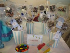 a table topped with cupcakes and candy