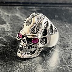 925 Silver Flaming Skull Jewelry , Biker Gothic Style Ring , Punk Swagger Engraved Skull Ring , Handmade Biker Gifts , Ring For Boyfriend , Gift For Him , Same Day For Shipping ✧ Product Details * Handmade İtem * Gender : Male / Female * Material : 925K Sterling Silver * Ring Weight : 14 Grams ✔ Usage Details * Silver jewelry is very sensitive to chemicals. It is recommended to keep away from chemical substances such as cream, bleach, deodorant, detergent. * Silver jewelry can also darken quickl Silver Skull Ring For Biker Events And Halloween, Silver Skull Ring For Halloween Streetwear, Punk Skull Ring For Halloween Streetwear, Silver Punk Skull Ring For Halloween, Sterling Silver Skull Ring In Punk Style, Punk Style Skull Rings For Biker Events, Biker Skull Ring For Biker Events, Silver Skull Ring In Punk Style, Punk Skull Ring For Biker Events