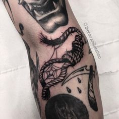 a man's arm with some tattoos on it