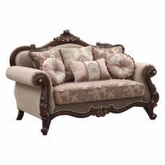 an ornately decorated couch with pillows on it