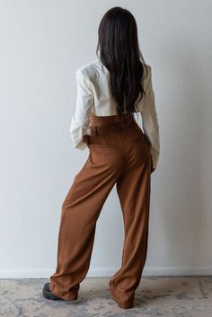 Meet your new fav pant for any season! Timeless and trendy are the Giselle Trouser featuring a loose fit with front pleat detail, side pockets and high waist. Color: Brown Loose Fit Front Pleats Pockets Wide Leg Mid Rise 100% Tencel Model is 5'7", size 25 in bottoms and is wearing size small High-waisted Bottoms With Side Pockets For Day Out, Day Out High-waisted Bottoms With Side Pockets, High Waist Pants With Side Pockets For Day Out, Chic High-waisted Cargo Pants For Day Out, High-waisted Pants With Side Pockets For Day Out, Chic Brown Bottoms With Side Pockets, Chic Wide Leg Cargo Pants For Workwear, Chic Relaxed Fit Cargo Pants For Work, Chic Straight Cargo Pants For Day Out