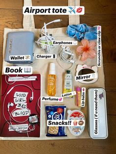 an airport tote bag filled with personal items on top of a wooden floor,