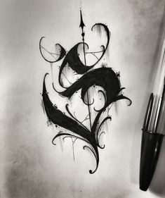 a black and white drawing of a letter s with swirly designs on the side