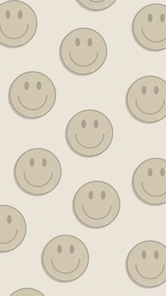 many smiley faces are arranged in rows on a white background with light gray circles around them