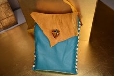 This bag is inspired by the contrasting colors of dawn, light tan meets turquoise and amber. Made of deer hide, organically and traditionally processed by the Shoshone tribe and hand made by myself of the Cree tribe. Artisan Blue Shoulder Bag As Gift, Handmade Turquoise Shoulder Bag For Everyday, Handmade Turquoise Bag For Gift, Handmade Turquoise Bags For Gifts, Handmade Turquoise Bags Perfect For Gifts, Deer Hide, Medicine Bag, Leather Craft, Contrasting Colors