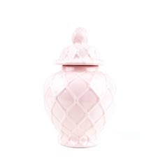 a pink vase with a lid on a white background