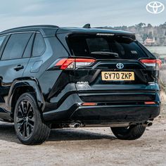 the rear end of a black toyota suv