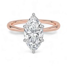 a rose gold ring with a pear shaped diamond