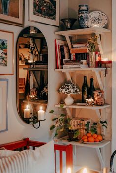 a living room filled with lots of furniture and pictures on the wall next to each other