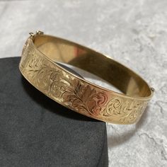 About the item: Gorgeous bangle- 1/5 9ct gold over bronze core. Measures internal diameter of 5.5cm. Signed AJ. In good condition, with a light patina, which could easily be polished to a high shine, should you wish to do so. Display box/stand not included. P&P includes postage, packaging and all related costs. Most items are sent tracked and signed for, where available/appropriate. Gold Bracelet With Decorative Band As Gift, Gold Bracelets With Decorative Band As Gift, Classic Gold Etched Bangle, Gold Bracelet With Decorative Band For Anniversary, Gold Victorian Cuff Bracelet With Intricate Design, Classic Gold Cuff Bracelet With Intricate Design, Gold Bangle With Decorative Band As Gift, Gold Victorian Bangle With Intricate Design, Gold Victorian Hinged Bangle