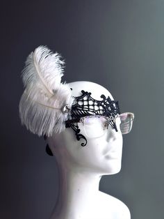 Made for eye glass wearers! Mask will fit around the frames of your eyeglasses comfortably.   Black lace masquerade mask with lovely feather clip attached. More colors for the feathers are available. S H I P P I N G  -   Last minute masquerade mask shopping? Quick processing available.  For 1-2 day guaranteed delivery, add items to cart, click on shipping tab for rates on last page of checkout. Msg us for delivery time frames (Include your state/country). S I Z E  Adult Size. Detailed dimensions Masquerade Mask Glasses, Masquerade Mask With Glasses, Adjustable Eye Masquerade Mask, Adjustable Eye Mask For Masquerade, Elegant Feathered Eye Mask For Masquerade, Masquerade Mask For Glasses, White Feather Mask, Lace Masquerade Mask, Lace Masquerade Masks