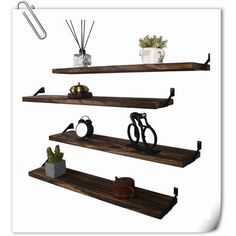 three wooden shelves with hooks, scissors and other items on top of them in front of a white background