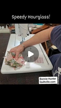 a person is using a sewing machine to sew some fabric on the table with text that reads speedy hourglass