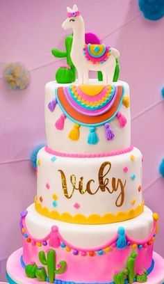 a three tiered cake with an animal on top and the words pricky painted on it