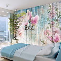 an image of a bedroom with flowers on the wall