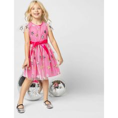 Our best-selling Aster Sequin Star Tulle Girls Party Dress, in Pink, is perfect for parties, the Holidays, Christmas, New Years celebrations, family photos, parties, prom, special occasions, ceremonies, flower girls & birthdays! The Aster dress is embroidered with twinkling stars, made of sequins in gold and silver on a fine fluid tulle, lined with a bright pink, silky fabric. The Aster dress is a fluid loose fit with a swirly skirt and a comfortable loose waist. The Aster dress has an easy zip Dresses For Children, Party Dress Pink, Girls Designer Dresses, Designer Party Dresses, Twinkling Stars, Ceremony Dresses, Luxury Girl, Boutique Clothes, Family Celebrations