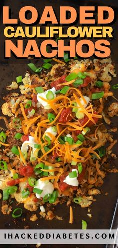 loaded cauliflower nachos with shredded cheese and green onions on the side