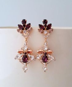 ✤ I can make these earrings with many other colors to match your wedding party scheme (or any other occasion). Please just contact me.✤ Matching bracelet here (can be made to match the earrings):https://etsy.me/2m0OSHZhttps://etsy.me/2lZU8LWhttps://etsy.me/2lzB0Efhttps://etsy.me/2lYNyW2https://etsy.me/2lEgimz✤ Matching hair comb here:✤ Matching necklace here:https://etsy.me/2kuVQ7Fhttps://etsy.me/2lyBOcu✤ Available in other metal finishes at the drop-down menu.✤ Made with CRYSTALLIZED™ - Swarovs Rose Gold Crystal Chandelier Drop Earrings, Rose Gold Crystal Chandelier Earrings, Rose Gold Crystal Chandelier Dangle Earrings, Rose Gold Crystal Dangle Chandelier Earrings, Elegant Purple Dangle Chandelier Earrings, Rose Gold Crystal Chandelier Earrings For Party, Rose Gold Crystal Dangle Earrings For Evening, Rose Gold Dangle Earrings For Evening Bridal Wear, Rose Gold Dangle Bridal Earrings For Evening