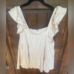 Purchased At Local Boutique And Never Wore It -Color Is “Baby Blush” But To Me, It’s More Of A Cream With A Hint Of Pink Beach Ruffle Sleeve Tops With Ruffles, Cute Brunch Tops With Ruffle Hem, Beach Tops With Ruffles And Flutter Sleeves, Beach Tops With Ruffle Sleeves And Details, Summer Flutter Sleeve Top With Ruffles, Beige Cotton Top With Ruffle Hem, Cute Ruffled Blouse For Vacation, Cotton Blouse With Ruffled Straps, Cotton Blouse With Ruffled Straps And Details