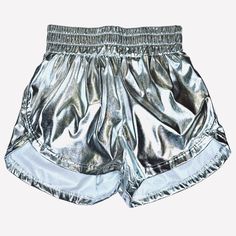 Get your game on with the Metallic Shorts. Its athletic fit and smocked elastic waist provide both comfort and style, while the metallic coating adds a touch of edginess. Perfect for any day, not just game day. Metallic Stretch Activewear For Sports, Metallic Athleisure Bottoms For Workout, Athleisure Athletic Shorts With Elastic Waistband For Cheerleading, Metallic Athleisure Bottoms For Sports, Casual Metallic Bottoms With Elastic Waistband, Metallic Stretch Bottoms For Athleisure, Silver Stretch Bottoms For Sports, Casual Shiny Metallic Bottoms, Sporty Metallic Activewear For Sports