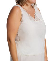 Easy to care for pure cotton camisole with gorgeous lace at the neck and adjustable straps. Deep V-neckline with Rochelle lace panels set into the base. Low-cut armholes. Panel set into back helps camisole fit closer and more naturally against the body. Wide satin non-stretch straps at back attach to neckline, and allow you to adjust fit with plastic hardware. Lace trim at neck, armholes, back, and hem. Relaxed fit. Pullover styling. Shadowline Women's Plus Cotton Batiste Camisole in White | Siz V-neck Tank Top With Lace Trim For Daywear, Daywear Sleeveless Bra-friendly Camisole, Bra-friendly Sleeveless Camisole For Daywear, Sleeveless Bra-friendly Camisole For Daywear, Bra Friendly Sleeveless Camisole For Daywear, Lace Bodice Camisole Top, Delicate Lace Daywear Tops With Spaghetti Straps, Daywear Cami Lace Top With Delicate Straps, Delicate Lace Cotton Camisole