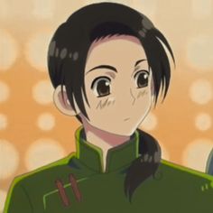 an anime character with long black hair and brown eyes wearing a green jacket, standing in front of a beige background