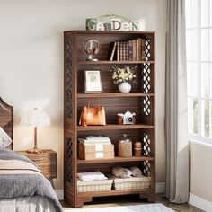 a bedroom with a bed, bookshelf and other items on the shelf in front of it