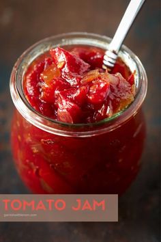 a jar filled with jam sitting on top of a table