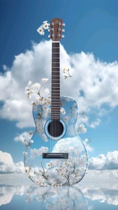 an acoustic guitar with white flowers on the top and blue sky in the back ground