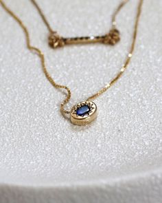 Solid gold necklace with sapphire pendant, inspired by the Evil Eye symbol. Solid gold Gemstone: Blue oval cut sapphire 3X4 mm | 0.1X0.15 inch Chain length: 42 cm | 16 inch Pendant size: 8x6 mm | 0.3x0.2 inch Packed in labeled gift box Feel free to contact me for details and special requests All items can be ordered in solid 14k/18k yellow, white or rose gold Please review terms and conditions before checkout For a matching ring: https://www.etsy.com/listing/572599973/sapphire-snake-ring-14k-gol Oval Gold Sapphire Jewelry, Oval Sapphire Gold Jewelry, Oval Sapphire Pendant, Gold Sapphire Necklace, Gold Sun Necklace, Necklace Sapphire, Sapphire Eyes, Sun Necklace, Oval Necklace