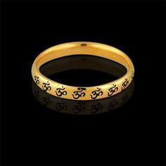 OM AUM Wedding Ring Gold Eternity Om Band Religious Wedding Black Painting Unisex Antique Finish Anniversary The OM (or AUM) sign is the main symbol of Hinduism. Most religions indicate that creation began with sound-- In the beginning was the word... For the Hindus & Buddhists, Om is the primordial sound, the first breath of creation, the vibration that ensures existence. Om sign signifies God, Creation, & the One-ness of all creation. This band is made of 14k yellow gold and is 2.7mm w Symbolic Black Jewelry For Wedding, Symbolic Black Wedding Jewelry, Symbolic Wedding Toe Ring Jewelry, Traditional Black Wedding Rings, Black Bangle For Wedding, Symbolic Yellow Gold Wedding Rings, Symbolic Round Band Wedding Rings, Symbolic Wedding Rings With Round Band, Symbolic Wedding Toe Rings