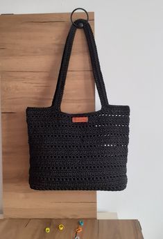 This elegant bag is 27 cm high and 34 cm wide; Knitted using high-quality Black polyester macrame yarn, it is durable, suitable for long-term use, hand-washable or machine-washable with warm water and mild detergent. Think of it as a special gift for your daily use or loved ones. If you have any questions, feel free to ask. Thank you and I wish you a pleasant shopping! Macrame Yarn, Crochet Black, Knitted Bag, Elegant Bags, Macrame Bag, Boho Accessories, Bag Crochet, Black Crochet, Boho Bag