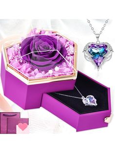 a purple rose in a heart shaped box with two matching necklaces and an ornament