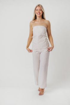 Elevate your outfit instantly with the Myrna Linen Top! This beauty is perfect for dressing up and going out, or styling with a cardigan for more casual days. You'll love its linen breathability and luxury feel. Pair with our Ellen Linen Pants in Khaki for the perfect summer set! FIT: Runs true to size. MATERIAL: 100% Linen. GARMENT DETAILS: Linen tube top with center back zipper. Features a longer length drape, with an A-line flare. SIZE GUIDE: XS (0-2) / S (2-4) / M (6-8) / L (10-12) / XL (14-16) MODEL DETAILS: MISSES Mackenzie - Size S Heather - Size S Bust 34" 34" Waist 27.5" 27.5" Hips 40.5" 37.5" Height 5'7" 5'7" Neutral Tops For Spring Loungewear, Neutral Spring Loungewear Tops, Relaxed Linen Tops For Day Out, Feminine Linen Tops With Relaxed Fit, Summer Flax Tops For Daywear, Feminine Relaxed Fit Linen Tops, Chic Linen Top In Flax Color, Beige Linen Tops For Vacation, Flax Colored Tops For Summer Daywear