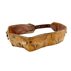 "Fashion meets function with this 1970's 100% leather utility style belt. The belt is made from high qualify brown leather and is beautifully worn from age. It's 2 3/8\" thick with a 6 snapping flap pocket compartments to store small, flat items. It has it's original metal hardware and adjusts in length from 28\" - 38\". A unique, retro addition to your wardrobe! Condition: Good vintage condition, beautifully worn leather. Measurements: Length adjusts from 28\" - 38\" Width 2 3/8\"" Leather Belt Bag With Pockets, Belt Sachel, Western Belt Bucket, Leather Adventure Belt, Leather Waste Belt, Took Belt, Brown Canvas Belt, Vintage Leather Belts And Suspenders, Vintage Leather Belts And Suspenders For Casual Use