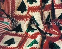 a crocheted christmas tree afghan is shown in red, white and green